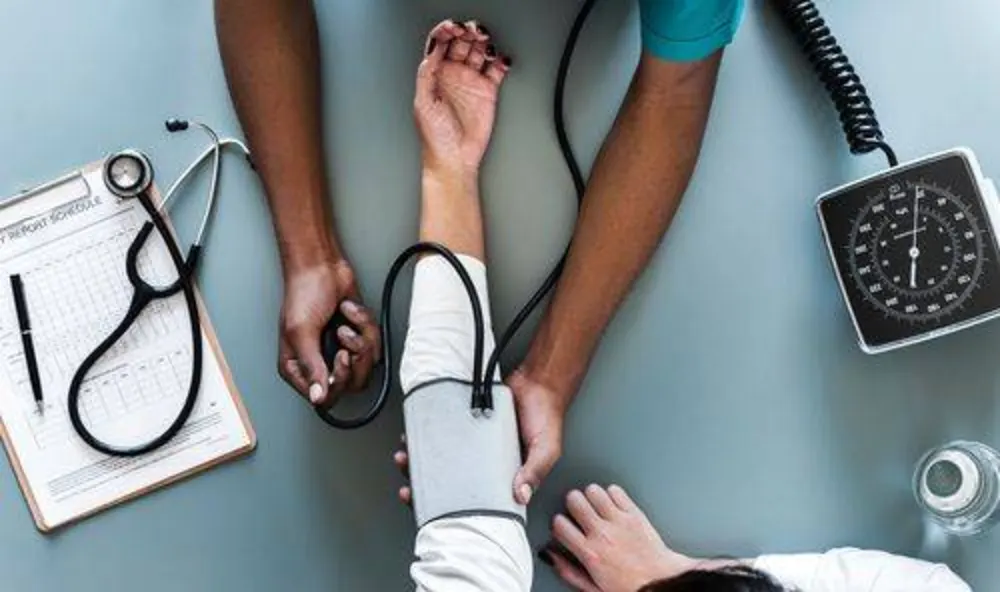 Clinician measuring a patient's blood pressure